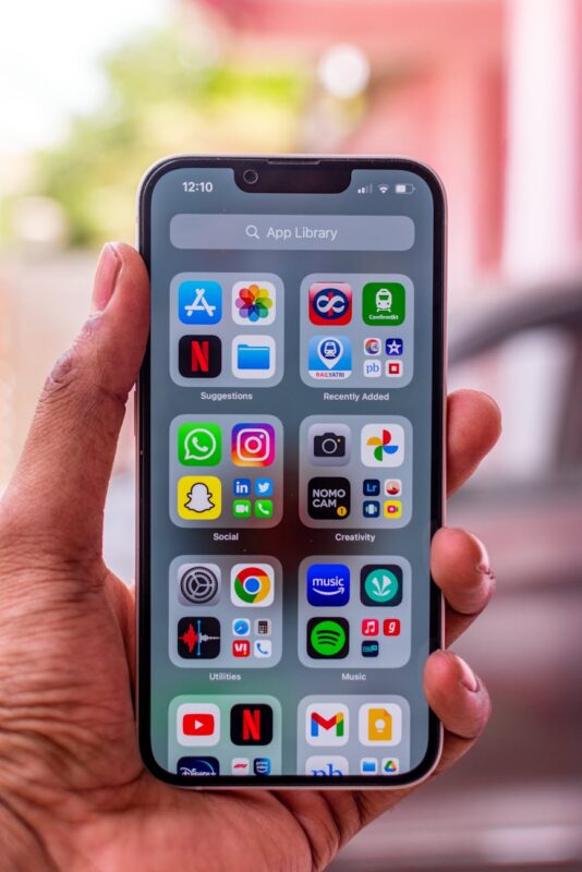 a hand holding an iphone