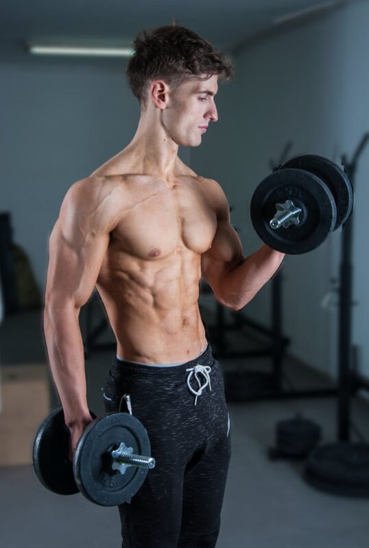 man lifting dumbells